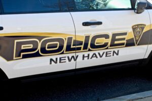 Up close shot of the side of a New Haven police car.